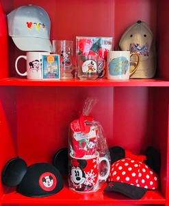 lot 389 image: Assorted Disney Themed Collectible Mugs, Caps, and Accessories