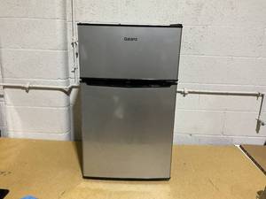 lot 109 image: Galanz 3.1 Cu Ft Mini Fridge with Freezer  Stainless Steel, Energy Star, Two-Door Compact Refrigerator