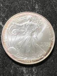 lot 77 image: 1999 AMERICAN SILVER EAGLE 1 TROY OZ .999 FINE SILVER