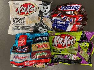 lot 30 image: Assorted Halloween Candy Bags Featuring Snickers and Kit Kat