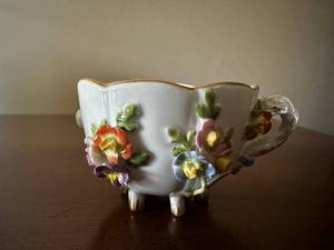 lot 69 image: Vintage Floral Porcelain Footed Cup with Hand-Painted Details