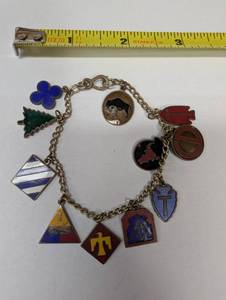 lot 398 image: Vintage Boy Scout Charm Bracelet with Enamel Badges