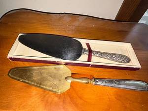 lot 453 image: Pair of Cake Servers Sterling Silver Handle & Brass Handle