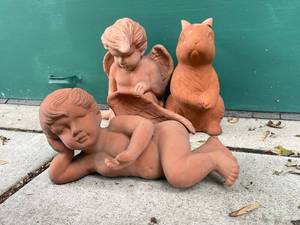 lot 662 image: Terracotta Angel and Animal Figurine Set