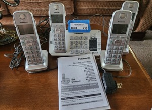 lot 435 image: Panasonic Cordless Phone System with 4 Handsets and Base Station