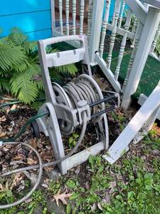 lot 104 image: Garden Hose Reel with Hose Attachment