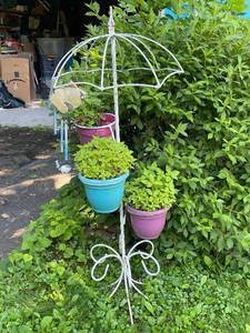 lot 107 image: Decorative Flower Plant Stand with Hanging Wind Chime