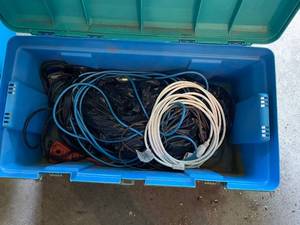 lot 132 image: Large Blue Storage Bin with Assorted Extension Cords