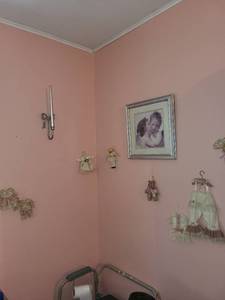 lot 333 image: Collection of Classic Nursery Decor with Framed Art and Miniature Clothing