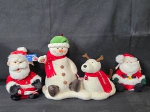 lot 15 image: Set of Holiday Plush Toys including Santa, Snowman, and Reindeer