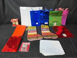 lot 22 image: Assorted Holiday Gift Bags, Stockings, and Mug