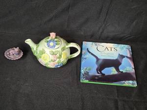 lot 94 image: Floral Porcelain Teapot, Cat Theme Anthology Book, and Cat Figurine Set