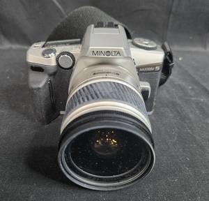lot 100 image: Minolta Maxxum 5 SLR Film Camera with AF Zoom Lens and Instruction Manual