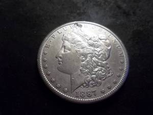 lot 12 image: 1887 S  Morgan Silver Dollar