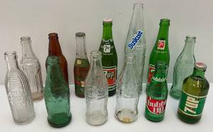 lot 118 image: Misc. Vintage Collectible Soda Bottles Including 7Up, Bubble Up And More