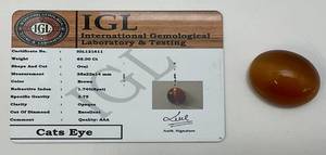 lot 152 image: IGL International Gemological Laboratory & Testing 65 CT Oval Cats Eye (Lab Created)