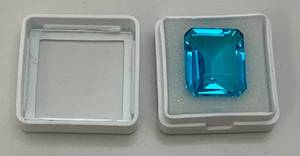 lot 154 image: 20.60 CT Blue Topaz Emerald Cut (Lab Created)