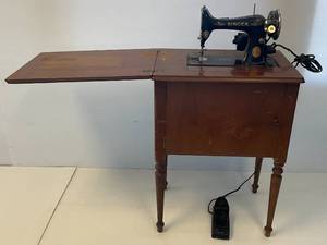 lot 245 image: Vintage Singer Sewing Machine In Cabinet With Extras (Cabinet Needs Work)