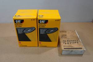 lot 24 image: 2 CAT Hydraulic Oil Filters and Manual