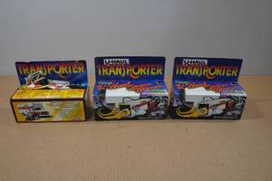 lot 129 image: 3 U-Haul Transporter Model Trucks