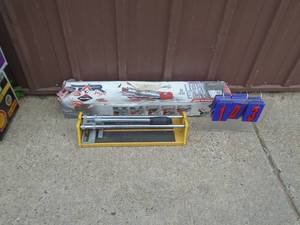 lot 103 image: Qty of 2 tile cutters. As shown.