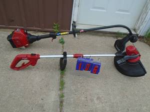 lot 106 image: Craftsman gas weed trimmer. Runs. 110 volt weed trimmer works. Almost new. As shown.