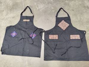 lot 85 image: Two Adjustable Aprons