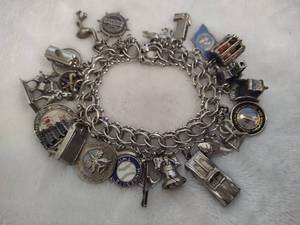 lot 102 image: Sterling Silver Charm Bracelet wTons of Charms