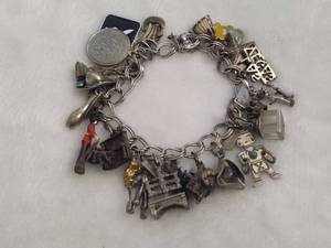 lot 104 image: Sterling Silver Charm Bracelet wTons of Charms
