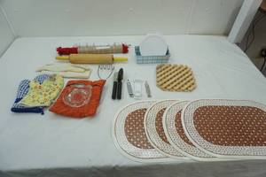 lot 169 image: Corelle Lids, Serrated Knife, Wooden Rolling Pin, Placemats, Oven Mitts, Juicer, Can Openers, Potato Masher