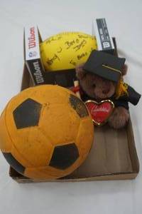 lot 180 image: Graduation Bear, Foam Soccer Ball, Foam Football, Nascar Hot Wheels, Organizer Baskets