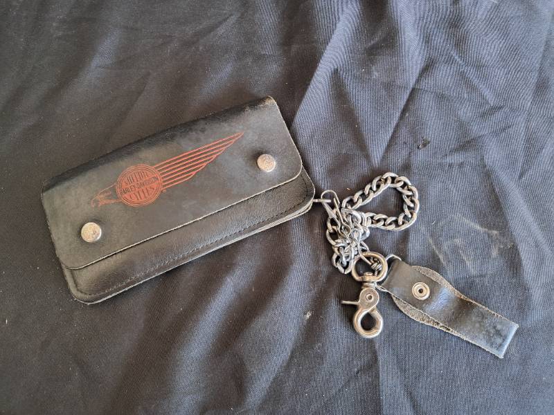 lot 26 image: Harley Davidson Lot (Leather Wallet, Cell Phone Holder, Patches, & Cup Cake Wraps)