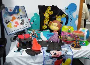 lot 27 image: MickeyMinnie Mouse Bags and Variety of toddler Toys in covered tote.