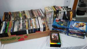 lot 54 image: DVDs and Blueray (approx. 70) See pics for details. Magnificent Seven, Tomb Raiders, Clock Stoppers.
