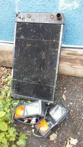 lot 62 image: 1966 Oldsmobile Delta 88 Radiator and Lights.