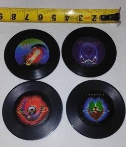 lot 111 image: Tiny Vinyl 4 in. Journey Collectible Records.