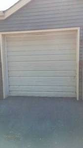 lot 145 image: Cabin Tear-down Insulated Garage Door, Rails and Chamberlin Opener.