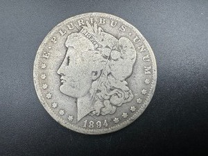 lot 20 image: Better Date 1894-O Morgan Silver Dollar