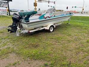 1996 Lowe Deck Boat with Trailer.