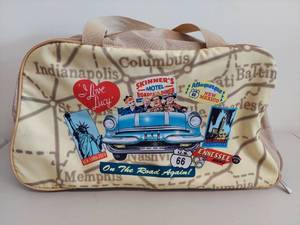 lot 38C image: I Love Lucy Vintage Travel Rolling Bag