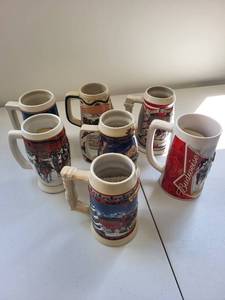 lot 52C image: Collection of 7 Budweiser Holiday Collectors Steins