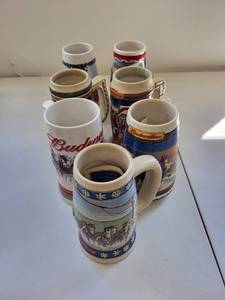 lot 54C image: Collection of 7 Budweiser Holiday Steins