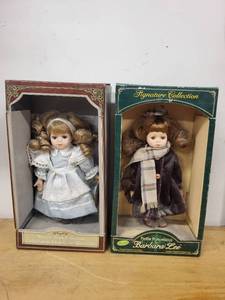 lot 20A image: Set of 2 Collectible Porcelain Dolls Signature Collection & Nursery Book Collection