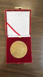 lot 89 image: Decorative Brass Medallion in Red Textile Box