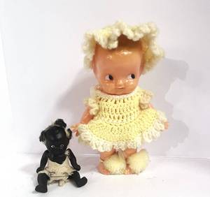 lot 57 image: Antique Porcelain Black Americana Jointed Doll and Celluloid Cupie Doll with Crocheted Dress