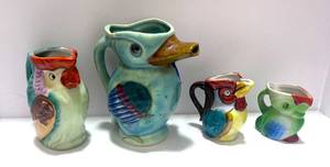 lot 81 image: Four Vintage Bird Pitchers-Kookaburra