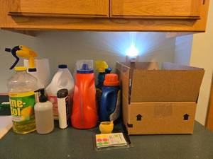 lot 86 image: Assorted Household Cleaning and Laundry Supplies Collection - content quantities unverified