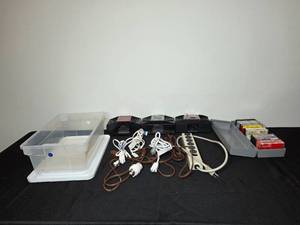 lot 256 image: Assorted Power Cords, Cassette Tapes with Holder, and Automatic Card Shufflers