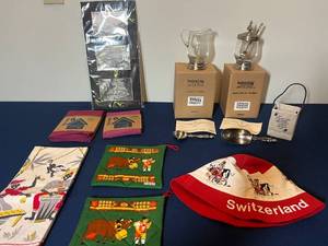 lot 324 image: Assorted Swiss Themed Kitchen and Decor Items with Art and Norwex Cloths
