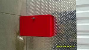lot 80 image: Red metal wall mount storage cabinet or first aid kit.
